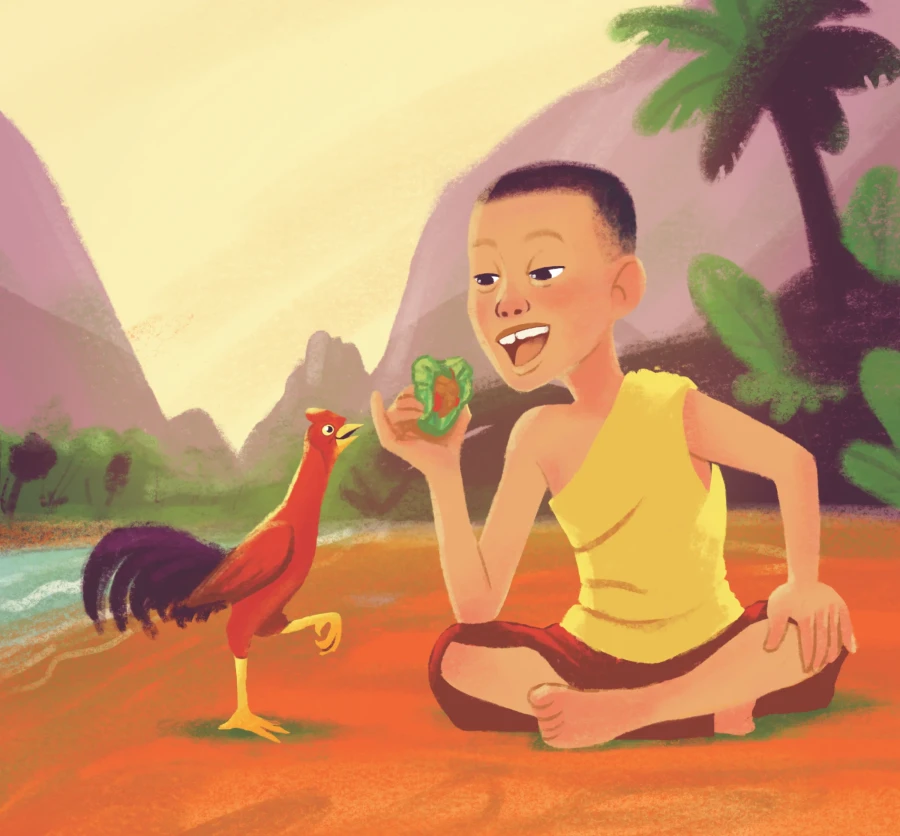 Kham, a young novice in a yellow robe, sits cross-legged by a stream holding a wrapped mieng, while his red rooster Gai Dang struts beside him.