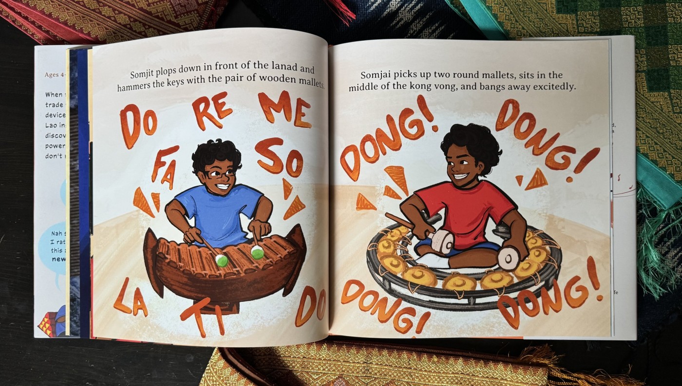 Colorful children's book illustration of two boys playing traditional musical instruments, with words like 'Do Re Mi Fa So La Ti Do' and 'DONG! DONG! DONG!' surrounding them.